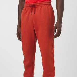 PANTALON JOGGER UNDER ARMOUR EARTHEN ORANGE/BLACK DAMA - NARANJA